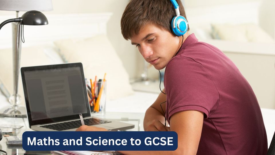 A teenage boy in headphones studying at his laptop for GCSE